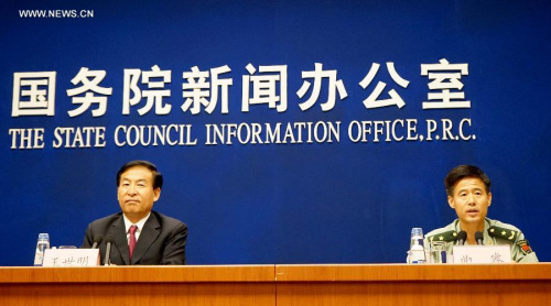 Qu Rui (R), deputy director of the Parade Steering Group Office, speaks at a press conference in Beijing, capital of China, June 23, 2015. China on Tuesday announced plans for commemoration of the 70th anniversary of the end of World War II on Sept. 3. (Photo: Xinhua/Chen Jianli)