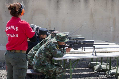 Chinese snipers compete in shooting relay on the opening day of the 14th Police and Military Sniper World Cup in Budapest, Hungary on June 21, 2015. (Photo: Xinhua/Attila Volgyi)