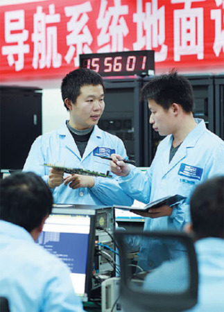 Scientists at the center prepare for the launch of the first satellite of the Beidou global system in January. (Photos provided to China Daily)