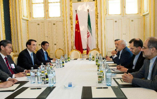Chinese Vice Foreign Minister Li Baodong (2nd L) meets withIranian Foreign Minister Mohammad Javad Zarif (3rd R) in Vienna, Austria, June 28, 2015. (Photo: Xinhua/Qian Yi)
