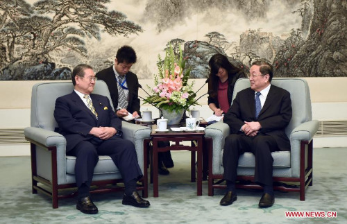 Yu Zhengsheng (R), chairman of the National Committee of the Chinese People's Political Consultative Conference, meets with a delegation of Japanese lawmakers led by veteran Liberal Democratic Party lawmaker Takeshi Noda in Beijing, capital of China, June 29, 2015. (Photo: Xinhua/Zhang Duo)