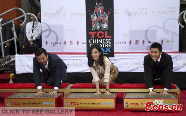 (L-R) Filmmaker Justin Lin, and Chinese superstars Zhao Wei and Huang Xiaoming leave their handprints at Hollywood's TCL Chinese Theatre, June 3, 2015. (Photo provided to China News Service)