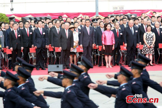 A flag-raising ceremony is held at Golden Bauhinia Square in Hong Kong to celebrate the 18th anniversary of the establishment of the Hong Kong Special Administrative Region (HKSAR), July 1, 2015. (Photo: China News Service / Hong Shaokui)