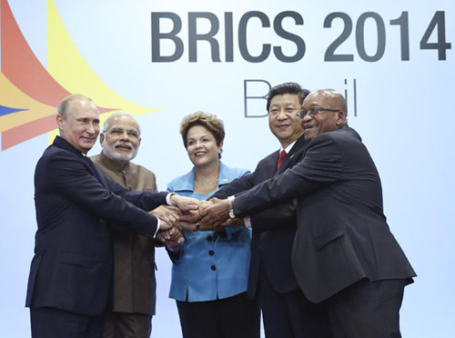 Chinese President Xi Jinping (2nd R) poses for a group photo with Russian President Vladimir Putin (1st L), Indian Prime Minister Narendra Modi (2nd L), Brazilian President Dilma Rousseff (C), and South African President Jacob Zuma during the sixth BRICS summit in Fortaleza, Brazil, July 15, 2014. (Photo: Xinhua/Lan Hongguang)