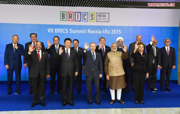 Chinese President Xi Jinping poses for photos with leaders of the Shanghai Cooperation Organization (SCO) members and observers, the Eurasian Economic Union (EEU) leaders, leaders of invited countries and the BRICS nations, namely Brazil, Russia, India, China and South Africa in Ufa, Russia, July 9, 2015. (Photo: Xinhua/Rao Aimin)