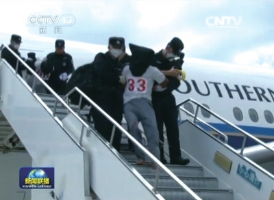  China defends Thailand's repatriation of illegal immigrants A screen grab from state broadcaster CCTV shows that illegal immigrants were repatriated from Thailand to China on Thursday.