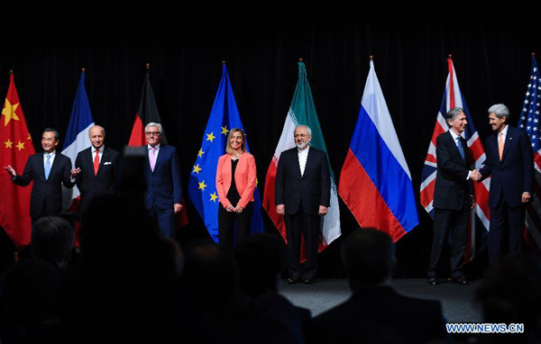Chinese Foreign Minister Wang Yi, French Foreign Minister Laurent Fabius, German Foreign Minister Frank Walter Steinmeier, European Union (EU) foreign policy chief Federica Mogherini, Iranian Foreign Minister Mohammad Javad Zarif, British Foreign Secretary Philip Hammond, and U.S. Secretary of State John Kerry (from L to R) pose for a group picture in Vienna, Austria, on July 14, 2015. (Xinhua/Qian Yi)