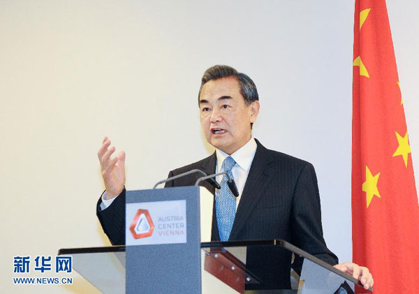 Chinese Foreign Minister Wang Yi speaks at a press conference following the announcement of the landmark Iran nuclear deal in Vienna, Austria, on July 14, 2015. (Photo/Xinhua)