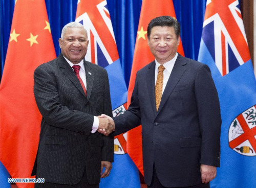 Chinese President Xi Jinping (R) meets with Fijian Prime Minister Voreqe Bainimarama in Beijing, capital of China, July 15, 2015. (Photo: Xinhua/Huang Jingwen)