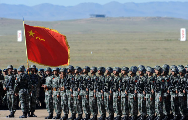 Chinese troops gather at the opening ceremony of the Peace Mission-2014 anti-terror drill at Zhurihe training base in North China's Inner Mongolia autonomous region on Sunday, August 24, 2014. (Photo/Xinhua)