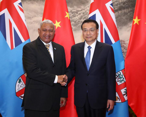 Chinese Premier Li Keqiang meets with Fijian Prime Minister Voreqe Bainimarama at the Great Hall of the People in Beijing on Thursday, July 16, 2015. (Photo/Xinhua)