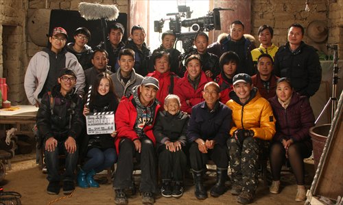 Wei Shaolan (middle), her son Luo Shanxue and the crew of documentary Thirty Two, which tells their story. (Photo: Courtesy of Guo Ke)