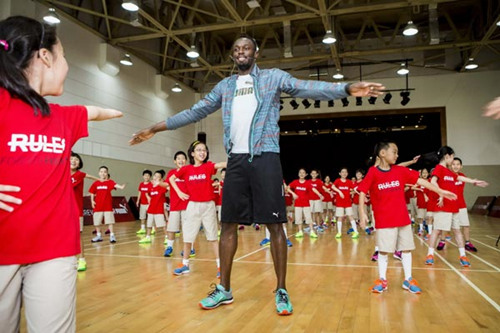 Usain Bolt visited a primary School in Shanghai last year. Photo provided to chinadaily.com.cn