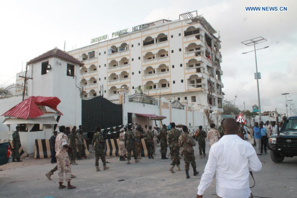 Photo taken on July 26, 2015 shows the Jazera Hotel after a suicide attack in Mogadishu, Somalia. At least 15 people were killed and several others injured Sunday in a hotel blast in the Somali capital Mogadishu, police said. (Photo: Xinhua/Faisal Isse) 