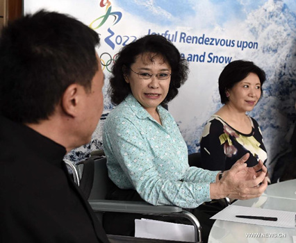 Zhang Haidi (C), vice president of the Beijing 2022 Olympic Winter Games Bid Committee, answers questions during a media briefing in Kuala Lumpur, Malaysia, on July 27, 2015. Hosting the 2022 Winter Paralympics would promote the development of China's sports of disabled people, said Zhang Haidi. (Xinhua/Gong Lei)