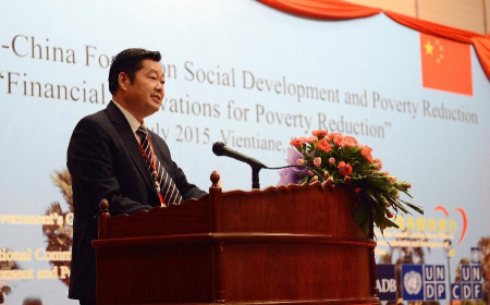 Hong Tianyun, deputy director of China's State Council Leading Group Office of Poverty Alleviation and Development of China (LGOP), addresses the 9th ASEAN-China Forum on Social Development and Poverty Reduction held in Vientiane, Laos, July 28, 2015.  (Photo: Xinhua/Liu Ailun)