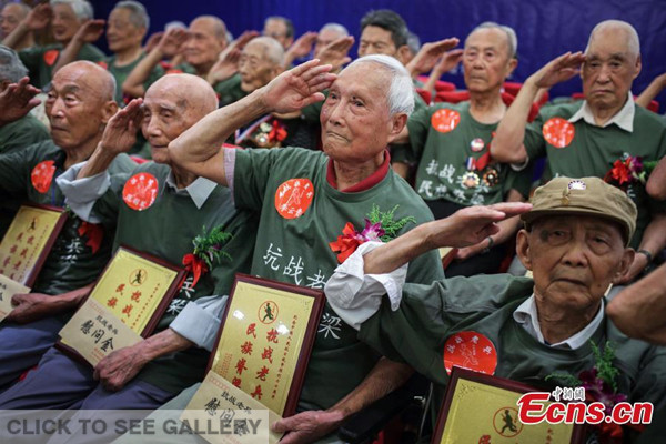 Thirty-three veterans from the War of Resistance Against Japanese Invasion (1937C1945) attend an event to mark the 78th anniversary of the July 7 Incident, in Nanjing, East China's Jiangsu province, July 5, 2015. (Photo: China News Service/Yang Bo)