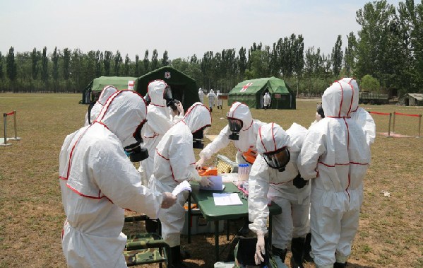 A nuclear emergency medical rescue drill codenamed "Medical Service Force �C 2015C" is conducted at a training base of the PLA Academy of Military Medical Sciences (AMMS) in July 2015.