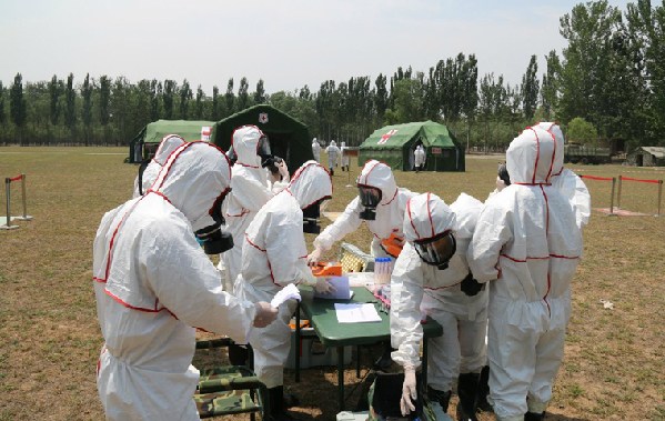 A nuclear emergency medical rescue drill codenamed "Medical Service Force C 2015C" is conducted at a training base of the PLA Academy of Military Medical Sciences (AMMS) in July 2015.