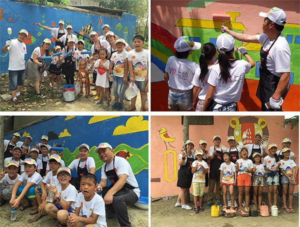 The volunteers and children draw pictures on the walls. (Photo provided to chinadaily.com.cn)