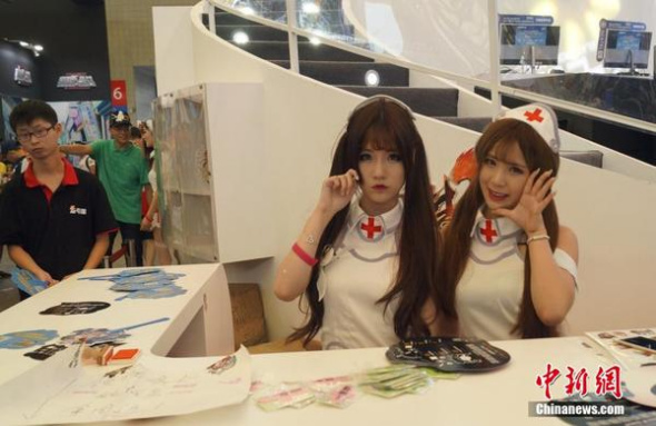 Models at Shanghai's annual digital entertainment expo ChinaJoy 2015, Aug. 2. (Photo/Chinanews.com)