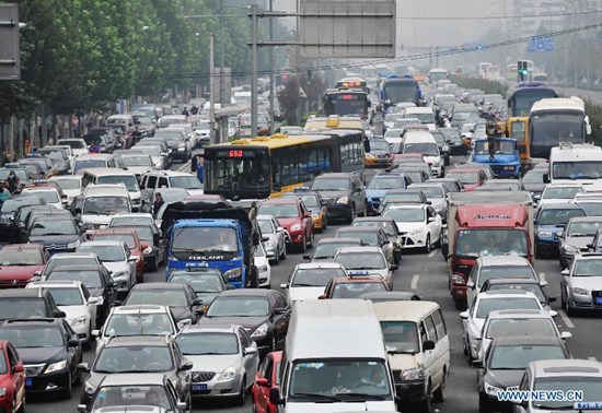 A main road of Beijing is crammed with cars in Beijing, capital of China, on Sept. 22, 2014, the World Car Free Day. Beijing's 21 million residents have been urged to use public transport and shun peak hours in September as the Chinese capital braces for the gridlock that comes with the beginning of the school year. (Xinhua/Li Wen)