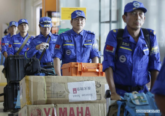 Members of the Blue Sky Rescue (BSR) Team, a non-governmental humanitarian organization, arrive at Yangon International Airport in Yangon, Myanmar, Aug. 4, 2015. (Photo: Xinhua/U Aung)