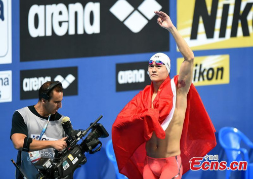 Sun Yang of China reacts after winning the men's 800m freestyle final at the Aquatics World Championships in Kazan, Russia, Aug 5, 2015. (Photo: China News Service/Hou Yu)