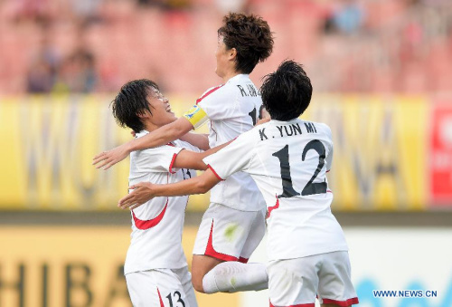 Players of the Democratic People's Republic of Korea (DPRK) celebrate victory after the match against South Korea at the 2015 EAFF(East Asian Football Federation) Women's East Asian Cup in Wuhan, capital of central China's Hubei Province, Aug. 8, 2015. DPRK won 2-0 and claimed the title of 2015 EAEF Women's East Asian Cup. (Xinhua/Cheng Min)