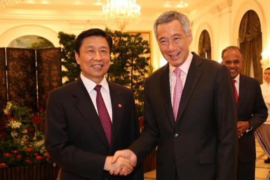 Singapore's Prime Minister Lee Hsien Loong (R) shakes hands with Chinese Vice President Li Yuanchao for the lunch held at Singapore's Istana, Aug. 9, 2015. Singapore's President Tony Tan Keng Yam hosted a lunch at the Istana for the various government representatives attending the National Day Parade on Sunday. (Photo/Ministry of Foreign Affairs Singapore)