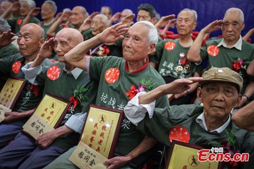 Thirty-three veterans from the War of Resistance Against Japanese Invasion (1937C1945) attend an event to mark the 78th anniversary of the July 7 Incident, in Nanjing, East Chinas Jiangsu province, July 5, 2015. (Photo: China News Service/Yang Bo)