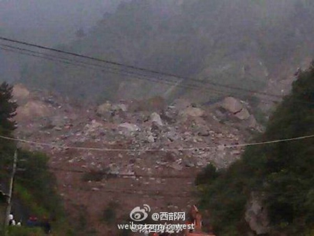 The landslide, which occurred at around 12:30 a.m. on Wednesday, buried 15 dorms and three houses. (Photo/Sina Weibo)