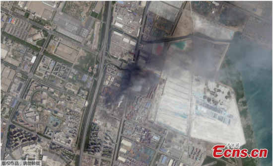 Google's aerial imagery shows the Binhai New Area of Tianjin after the blast. Fires after massive warehouse blasts in the northern Chinese port of Tianjin on Wednesday night are now under initial control. (Photo/CFP)