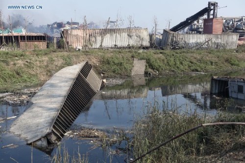 Photo taken on Aug. 13, 2015 shows damaged area near the explosion site in Binhai New Area of Tianjin, north China. (Xinhua/Cai Yang) 