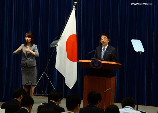 Japanese Prime Minister Shinzo Abe speaks during a news conference in Tokyo, Aug. 14, 2015. In a statement on Friday marking the 70th anniversary of the end of World War II, Abe mentioned previous governments' apology for Japan's wartime past, but refrained from offering his own apology. He also said that Japan must not let its future generations be predestined to apologize. (Xinhua/Ma Ping)