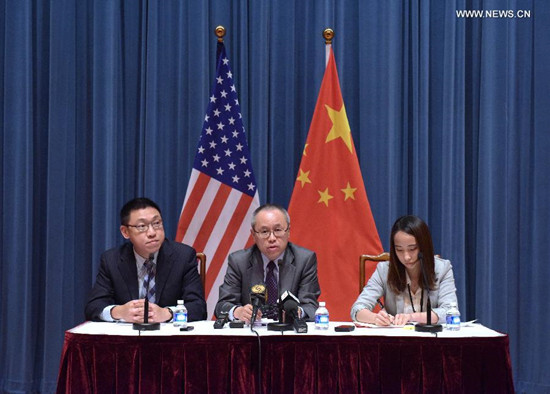 Director of international division of Chinese Foreign Ministry Li Junhua(C) holds a briefing of the 19th Human Rights Dialogue in Washington, Aug. 15, 2015. 