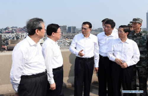 Chinese Premier Li Keqiang (3rd L) visits the site of Tianjin blasts in north China's Tianjin, Aug. 16, 2015. He will visit fire fighters, rescuers and those injured in the calamity. He will also direct further rescue operations and treatment of the injured, as well as handling of the aftermath and production safety. (Photo: Xinhua/Zhang Duo)