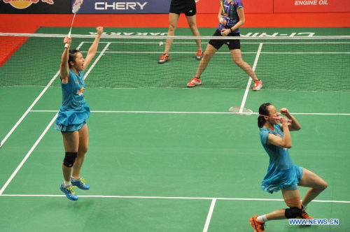Tian Qing (L) and Zhao Yunlei of China celebrate after winning their women's doubles final match against Christinna Pedersen and Kamilla Rytter Juhl of Denmark at the BWF World Championships 2015 in Jakarta, Indonesia, Aug. 16, 2015. Tian Qing and Zhao Yunlei won 2-1 to claim the champion. (Photo: Xinhua/Veri Sanovri)
