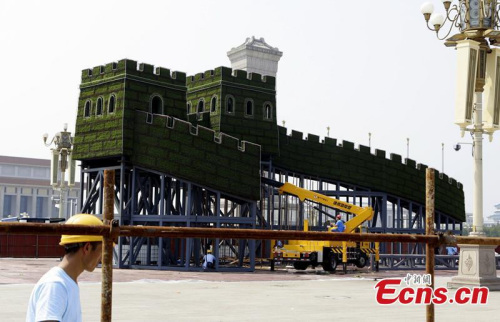 Frames are set to prepare for the flower decoration at the Tiananmen Square in Beijing, capital of China, Aug. 12, 2015. (CNS photo/ Lihuisi)