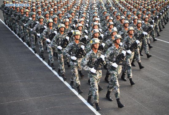 Photo taken on July 29, 2015 shows soldiers participating in training for the Sept. 3 military parade at the parade training base. (Photo: Xinhua/Tian Feng)