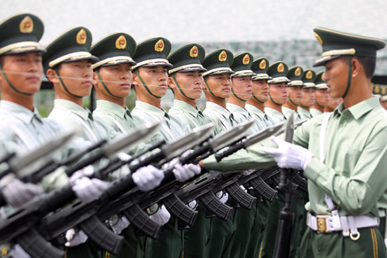 Soldiers of a marching unit look on during a training session ahead of the Sept 3 military parade to mark the 70th anniversary of the victory in the War of Resistance against Japanese Aggression. (Photo: China Daily/Zhou Hong)