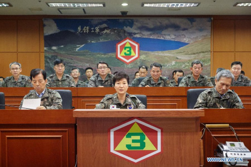 South Korean President Park Geun-hye (C, front) is seen at the headquarters of the Third Army in South Korea on Aug. 21, 2015. South Korea's top military officer on Friday warned the Democratic People's Republic of Korea (DPRK) of a harsh price for any further provocations. (PhotoXinhua/Seigadai Palace)