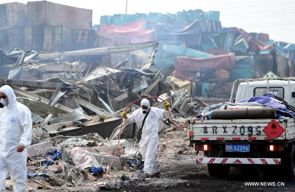 Rescuers clean up debris in the core blast area in Tianjin, Aug. 24, 2015. Rescue authorities updated the death toll from the Tianjin warehouse explosions to 129, with 44 others missing, on Monday.  (Photo: Xinhua/Zhang Chenlin)