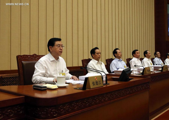 Zhang Dejiang (1st L), chairman of the Standing Committee of China's National People's Congress (NPC), attends the 16th meeting of the 12th NPC Standing Committee, in Beijing, capital of China, Aug. 24, 2015. China's top legislature will convene its bi-monthly session from Aug. 24 to 29 to review multiple draft law amendments and reports. (Photo: Xinhua/Liu Weibing) 