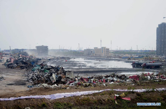 Debris near the core area of explosion site is cleared up in Tianjin, north China, Aug. 25, 2015. The death toll from the Tianjin warehouse explosions rises to 135 as of Tuesday afternoon, according to the latest data from rescue authorities. (Photo: Xinhua/Zhang Chenlin)