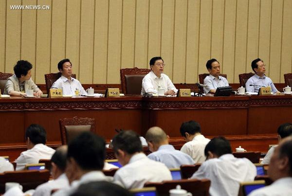 Zhang Dejiang (C rear), chairman of the Standing Committee of China's National People's Congress (NPC), presides over the closing meeting of the 16th session of the 12th NPC Standing Committee in Beijing, capital of China, Aug. 29, 2015. (Xinhua/Liu Weibing) 