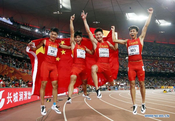 China's Xie Zhenye, Su Bingtian, Zhang Peimeng and Mo Youxue celebrate after the men's 4x100m relay final at the 2015 IAAF World Championships at the Bird's Nest National Stadium in Beijing, capital of China, Aug. 29, 2015. China ranked 2nd after the United States was disqualified. (Xinhua/Wang Lili)