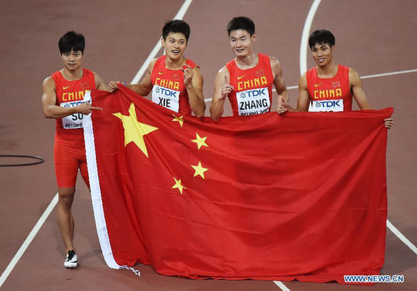 (From L to R)China's Su Bingtian, Xie Zhenye, Zhang Peimeng and Mo Youxue celebrate after the men's 4x100m relay final at the 2015 IAAF World Championships at the Bird's Nest National Stadium in Beijing, capital of China, Aug. 29, 2015. China ranked 2nd after the United States was disqualified.(Xinhua/Wang Haofei)