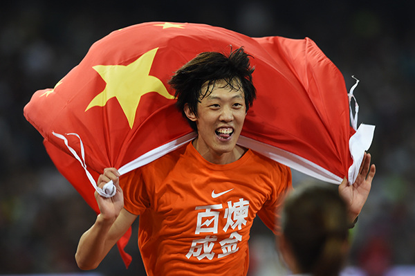 High jumper Zhang Guowei celebrates after winning a sliver medal at the Bird's Nest on Sunday.WEI XIAOHAO/CHINA DAILY