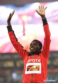 Silver medalist Kenya's Helah Kiprop celebrates during the awarding ceremony of the women's marathon event at the 2015 IAAF World Championships at the Bird's Nest National Stadium in Beijing, capital of China, Aug. 30, 2015. (Photo: Xinhua/Yue Yuewei)